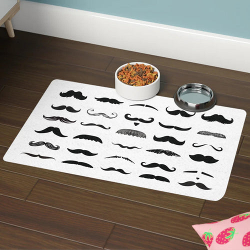 Pet mat with mustache designs on a wooden floor with a bowl of food and water dish.